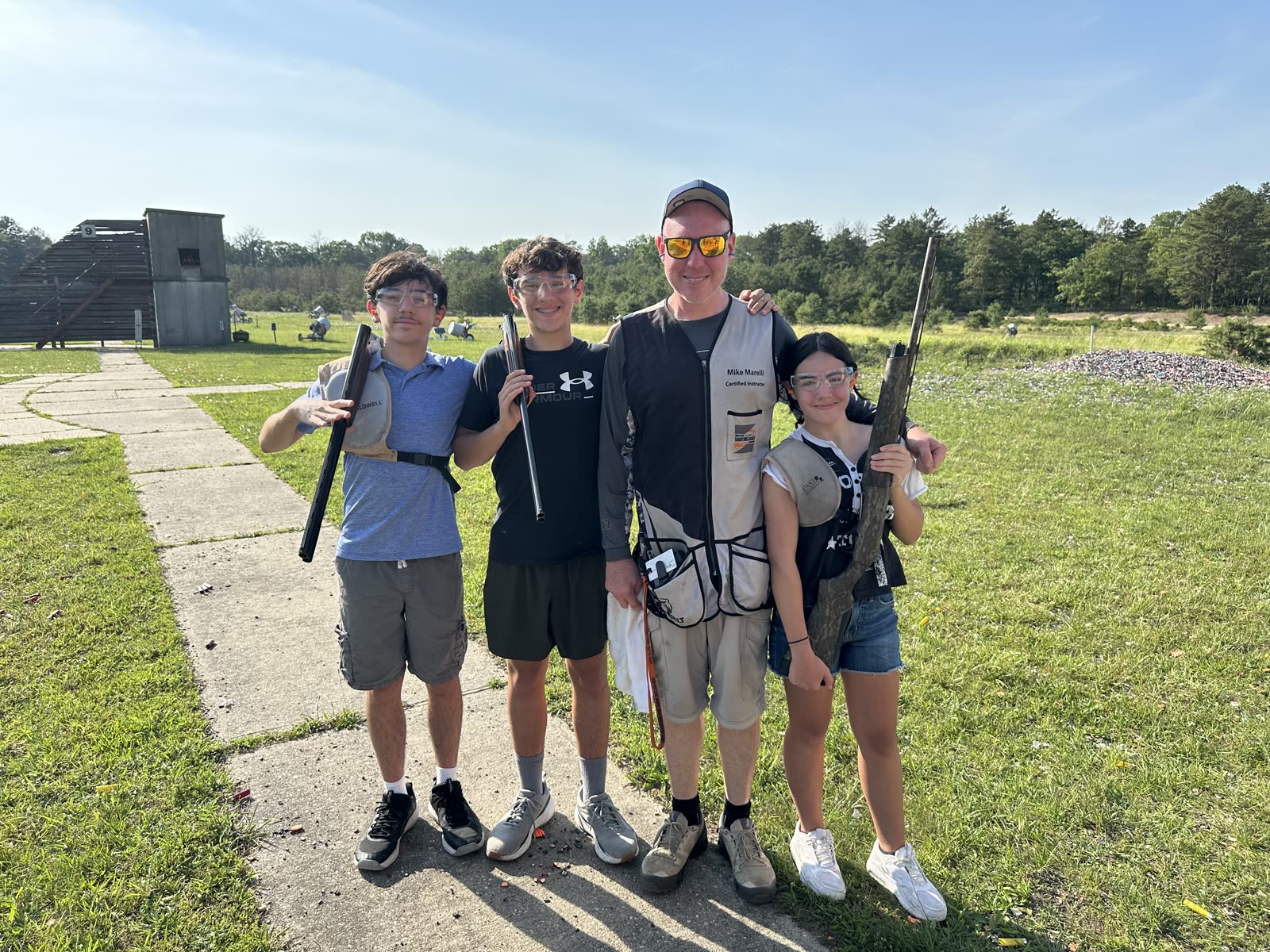 Mike Marelli with students on the field, Certified Instructor vest
