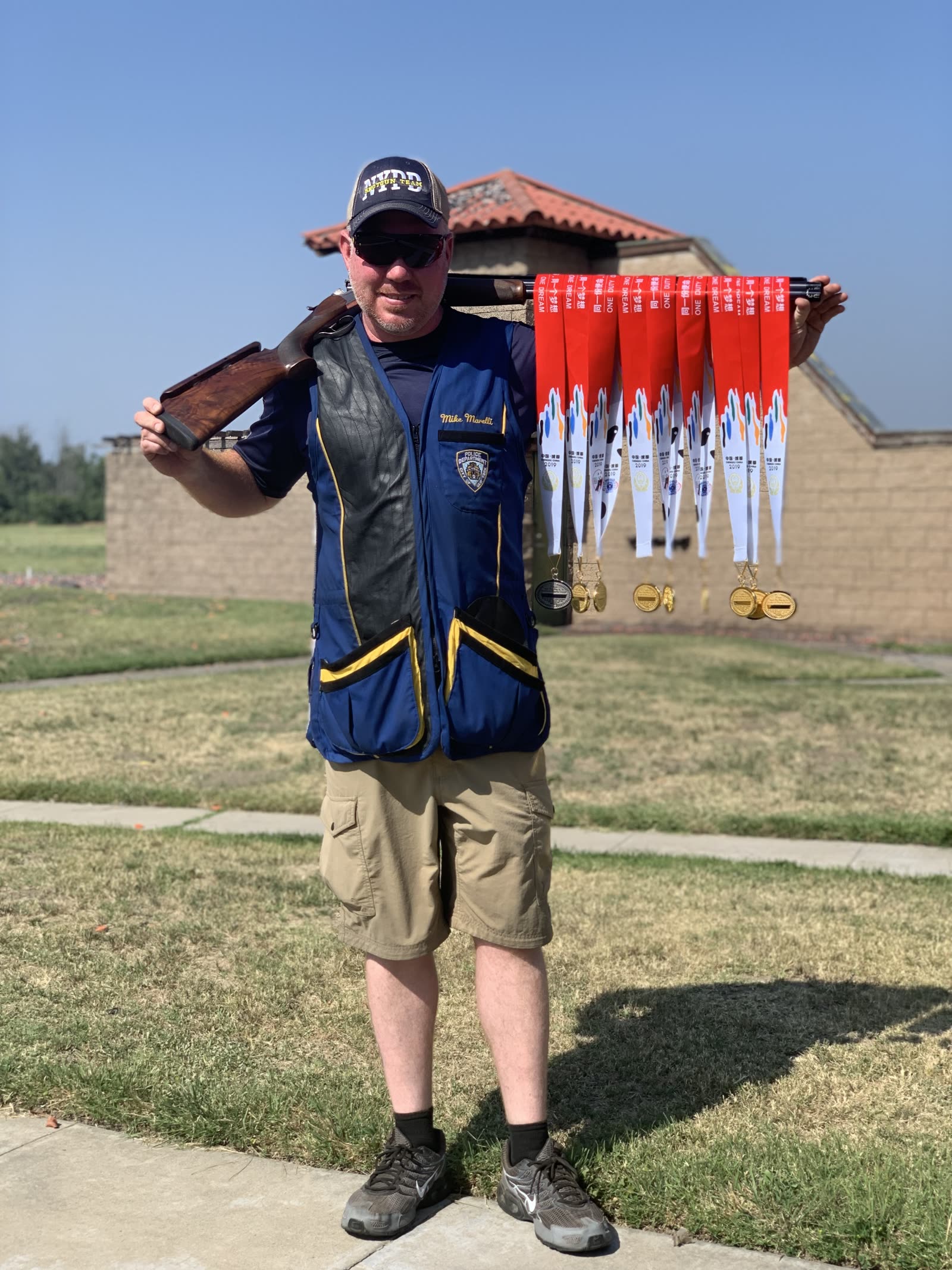 Mike with World Games medals on his shotgun